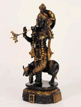Black and gold brass Venugopal statue, flute held while standing on cow