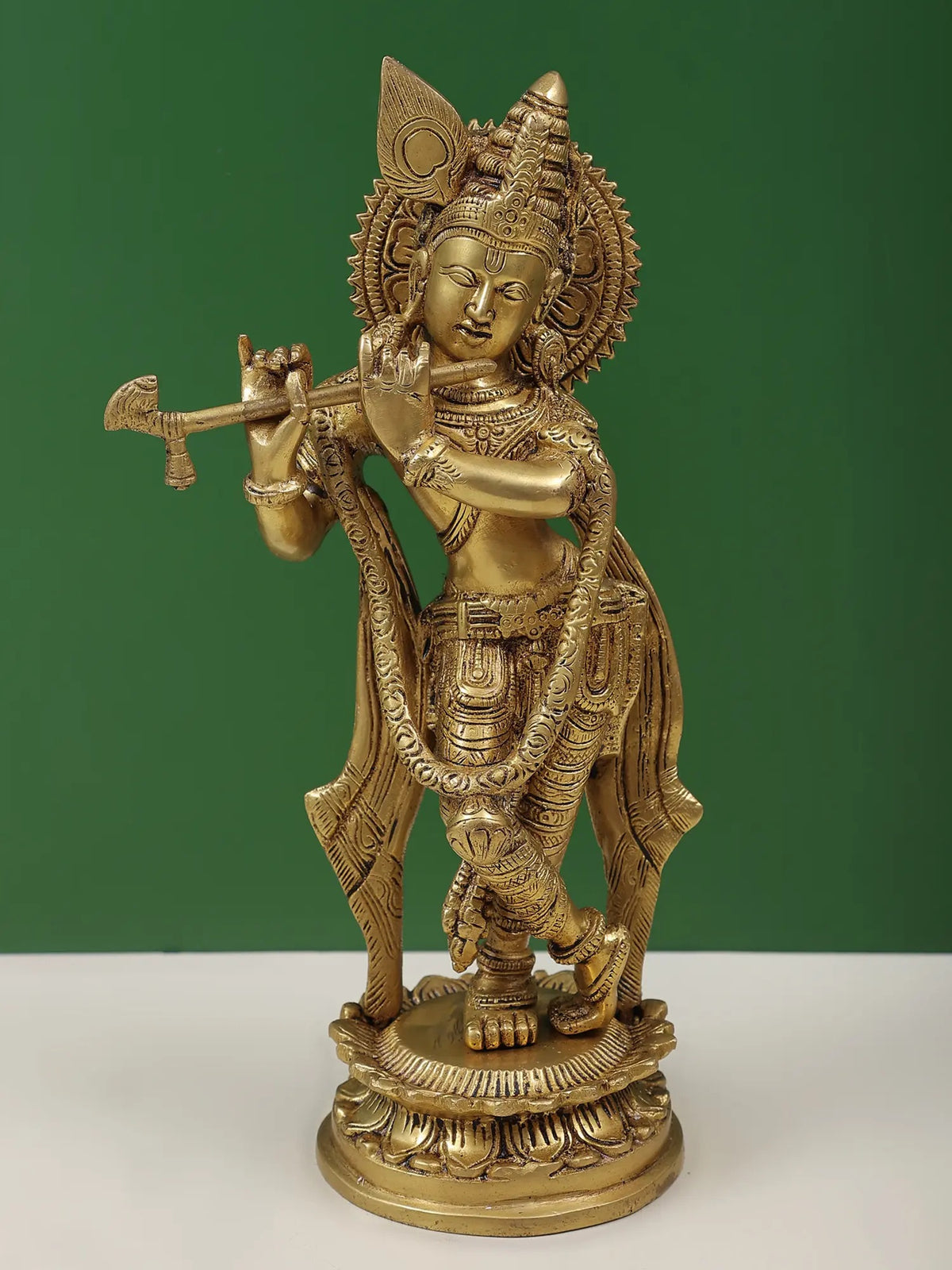 Brass Murlidhar Krishna sculpture holding flute, embossed details, 11 in