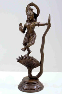 Brass Krishna statue, dancing pose with raised hand, serpent-hood pedestal