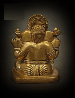 Back view of small brass Ganesha sculpture, seated posture with stacked arms