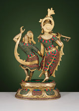 Brass Radha-Krishna dancing sculpture with ornate crowns and jeweled inlay details