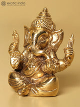 Lord Ganesha gold statue, seated with four hands raised in blessing, 2 inches
