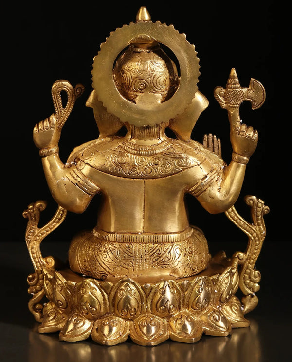 Brass statue of Ganesha seated in Kamalasana pose 8 inches Study Setting