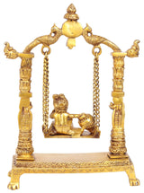 Golden brass Krishna butter swing figurine on chained seat, arched frame, 11 in.