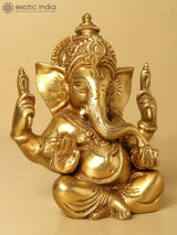 Lord Ganesha statue in blessing pose, raised hands, detailed gold finish, 5 inches.