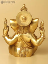 Lord Ganesha statue back view, round emblem, gold finish, 5 inches tall.