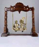 Brass Radha-Krishna on wooden swing, carved arch top with hanging chains