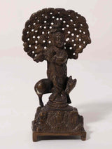 Small brass Venugopal (Krishna) statue playing flute with cow, tree canopy