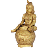 Handmade brass Murali Krishna statue seated, detailed robe jewelry and pot patterns