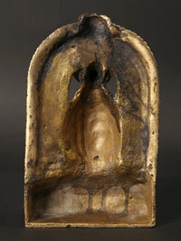 Back view of brass Lord Shiva head idol, textured patina and arched head frame