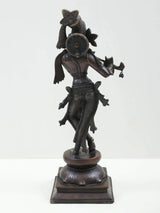 Brass-look Lord Krishna statue standing with flute, back/side view, detailed jewelry and pedestal base