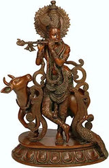 Large brass Krishna flute sculpture with cow and peacock, 21 in