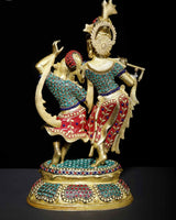 Brass Radha-Krishna dancing sculpture with ornate inlay on clothing and base