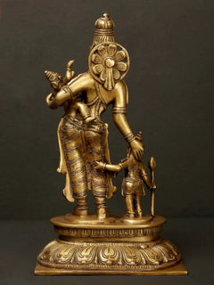 Brass Parvati and Ganesha with Karttikeya, side view on carved base.