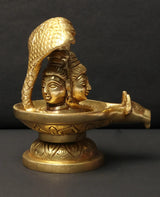 Small brass Shivalinga idol with raised cobra hood and seated faces, 4 in