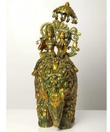 Handmade greenish-gold brass Radha and Krishna seated on an elephant statue, 23 in