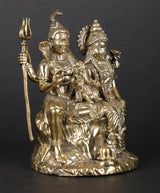 Brass statue side view of Shiva holding trident beside Parvati and little Ganesha