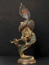 Brass Krishna statue with jeweled crown and flute-playing pose, stylized inlay design