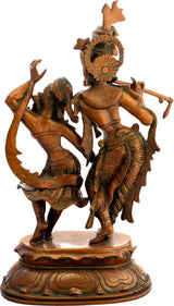Brass Radha-Krishna dancing statue (back view), raised arms, ornate detailing, round base