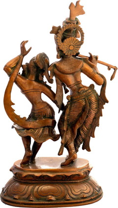 Brass Radha-Krishna dancing statue (back view), raised arms, ornate detailing, round base