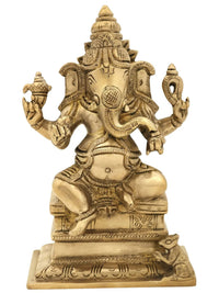 Brass four-armed Ganesha statue seated on high pedestal, 6 inch