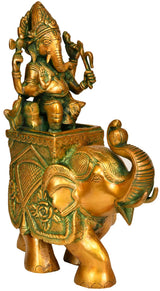 Brass Ganesha on elephant figurine, ornate green-gold trim, 11 in