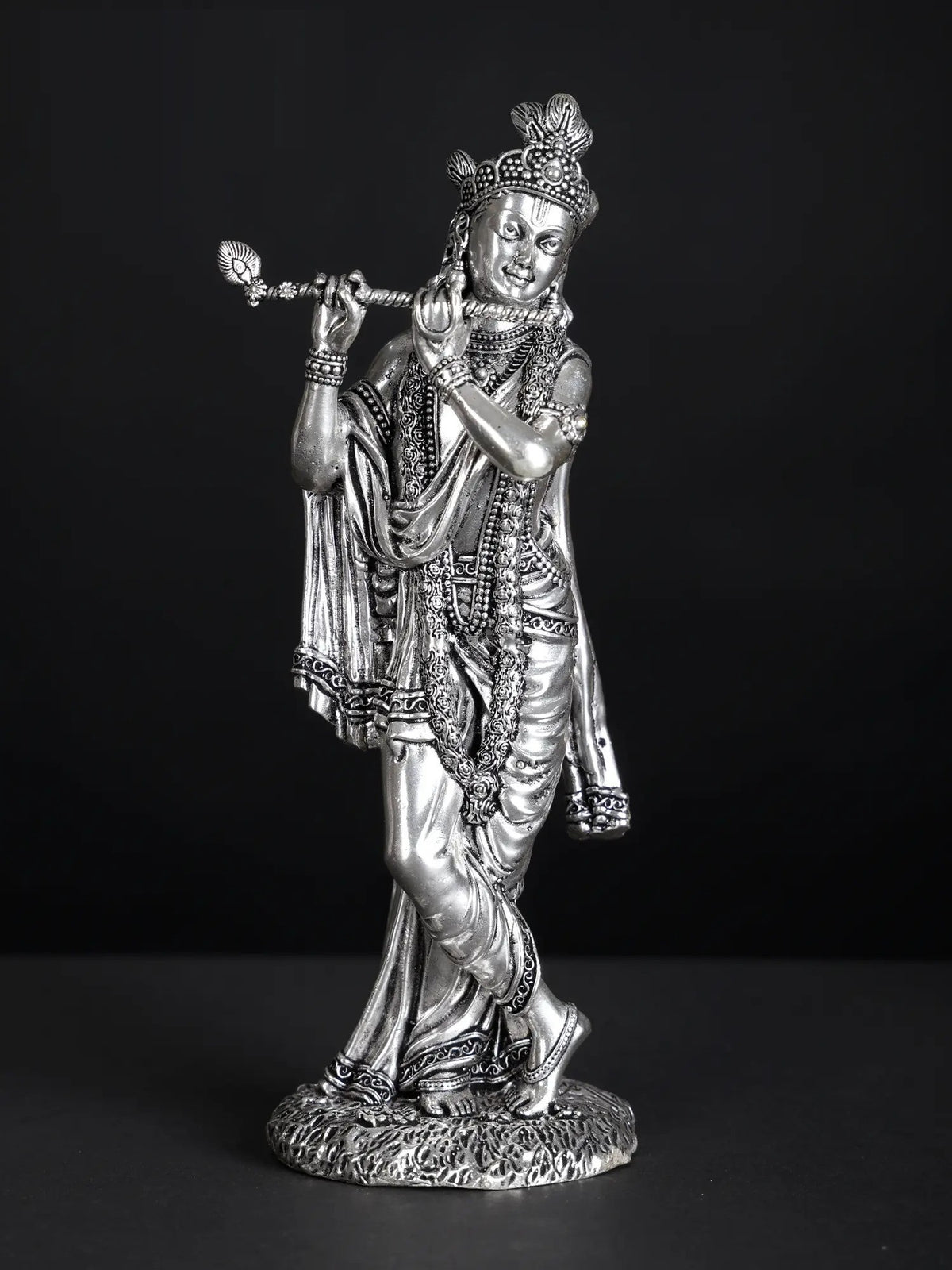 Silver-plated Lord Krishna statue, flute-playing with ornate crown and jewelry
