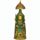 Brass Ganesha idol with Lakshmi carving on pedestal, ornate gold-toned top