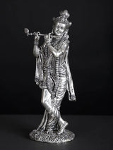 Silver-plated Lord Krishna statue, side view holding flute, detailed garments