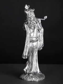 Silver-plated Lord Krishna statue, back view with draped robe and flute raised
