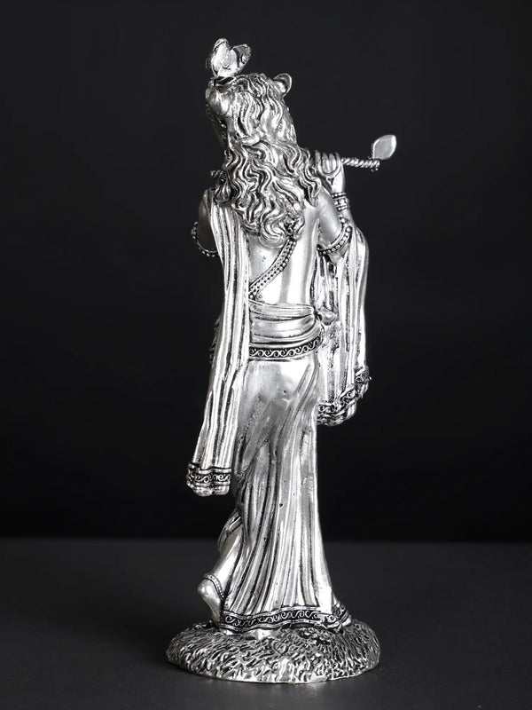 Silver-Plated Brass Statue of Lord Krishna Playing the Flute 7 inches Study Setting