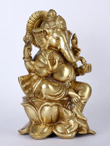 Lord Ganpati Ji idol seated on lotus, golden finish, profile view with ornaments