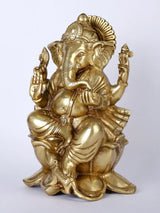 Lord Ganpati Ji idol seated on lotus, golden finish, side view with raised palms