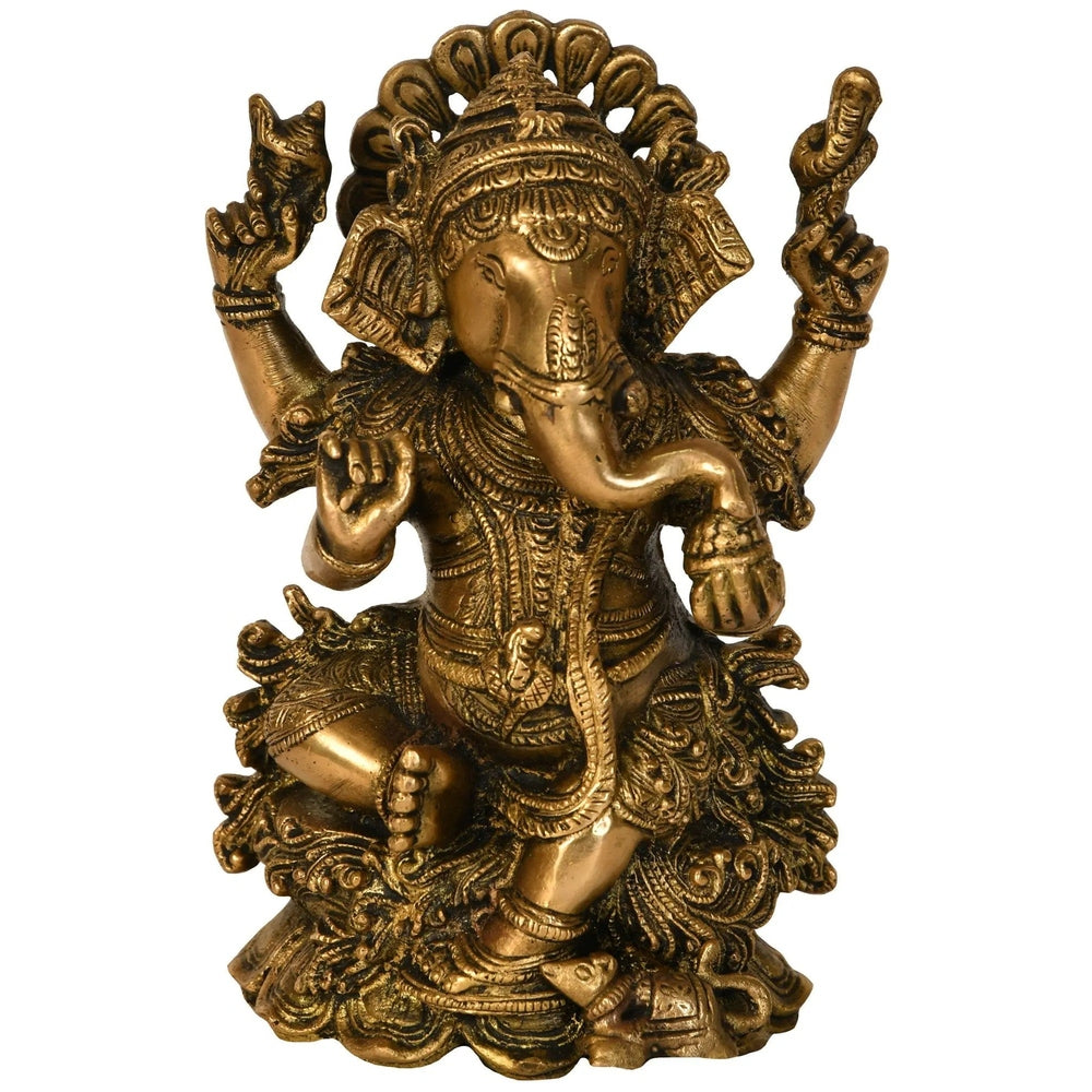 Brass Ganesha statue seated on a lotus with four raised arms