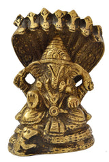 Ganesha idol with seven-hooded serpent canopy, gold tone, handmade