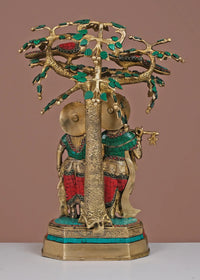 Brass Radha-Krishna sculpture with detailed tree trunk, green/red inlay, 19-inch