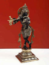 Black brass Lord Krishna playing the flute statue on ornate base, 12 inch