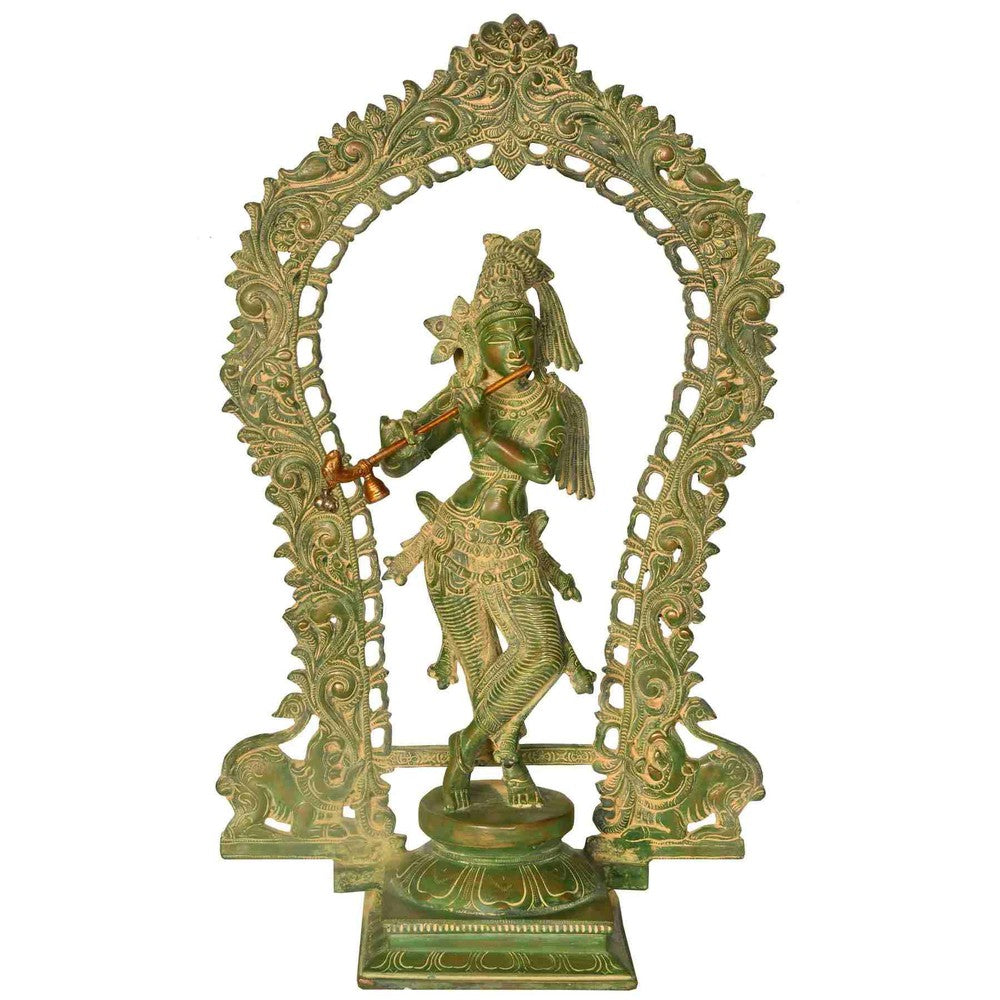 Handmade Krishna statue in dark brass finish with ornate aureole, fluting pose, 18 in