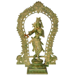 Handmade Krishna statue in dark brass finish with ornate aureole, fluting pose, 18 in