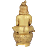 Back view of handmade brass Murali Krishna statue with ribbed hair and carved pot