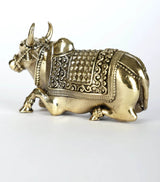 Brass Nandi statue figurine, side view with detailed harness, saddle panels, and hooves