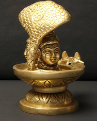 Small brass Shivalinga idol from side, cobra hood details over shivalinga, 4 in