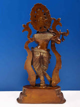 Brown brass Krishna statue from side view, holding flute, detailed skirt ornaments, 14 inch