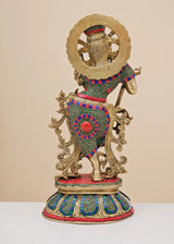 Rear view of brass Krishna flute sculpture with patterned inlay and ornate back