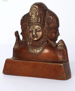 Small brass Trimurti statue side view with detailed crown and halo