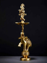 Brass Krishna flute lamp on elephant base, diya stand with bowl holder