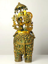 Rear view of AONA handmade brass Radha and Krishna on elephant with decorative arch top