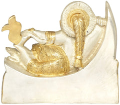 Gold-and-silver Ganesha idol with ornate wings on crescent moon base