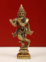 Brass Lord Shri Krishna idol playing flute, standing on pedestal, ornate details