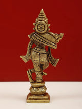 Brass Shri Krishna idol playing flute, side view with circular motif on chest